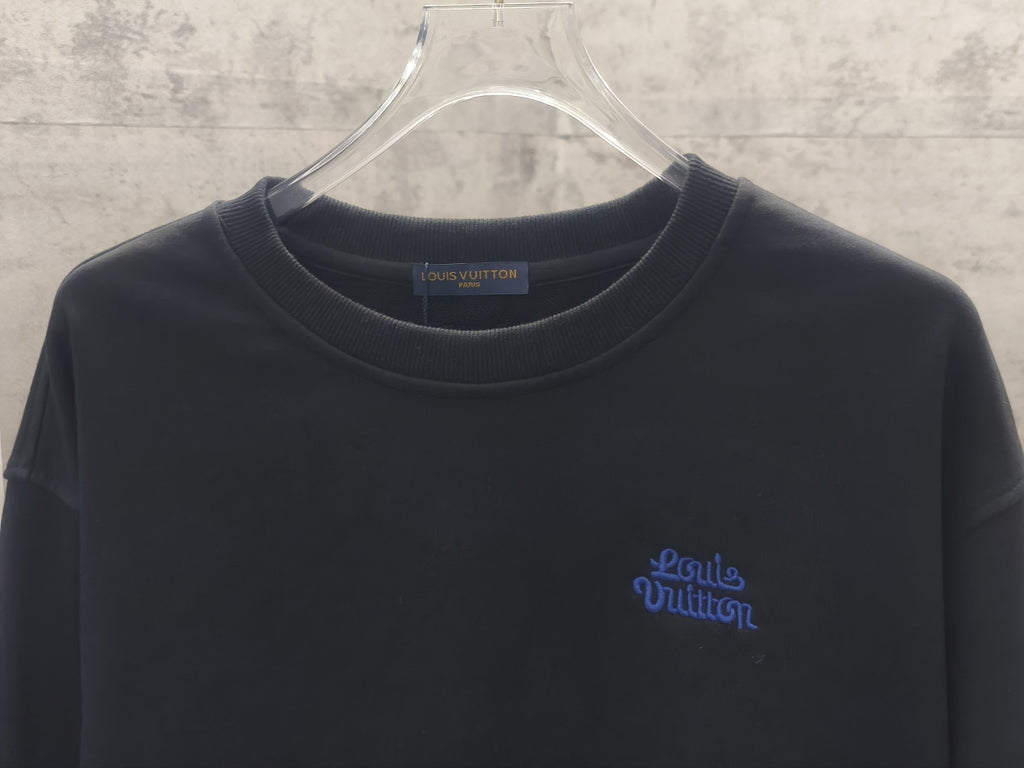 Dark long-sleeve crewneck sweatshirt with small blue front logo