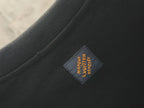 Close-up of neck label tag on dark crewneck sweatshirt