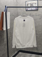 White long-sleeve sweatshirt on hanger, back view