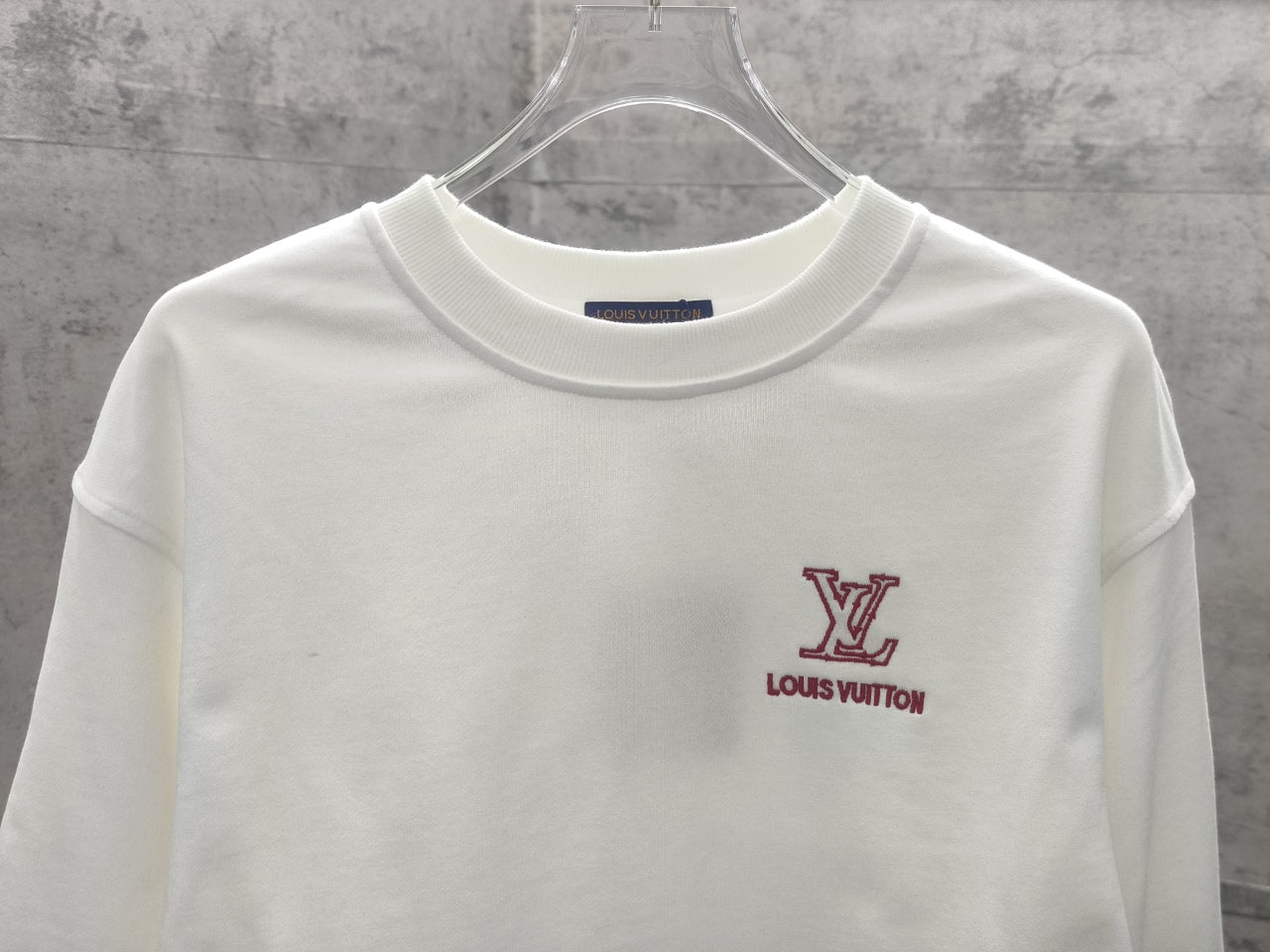 White long-sleeve sweatshirt with Louis Vuitton LV logo and text