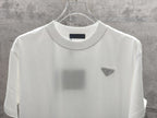 White short-sleeve T-shirt with crew neck and triangular chest logo