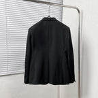 Black Dior suit jacket from the back, centered with shoulder seams and smooth hem