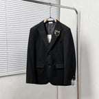 Black Dior suit jacket with notched lapels and two front flap pockets