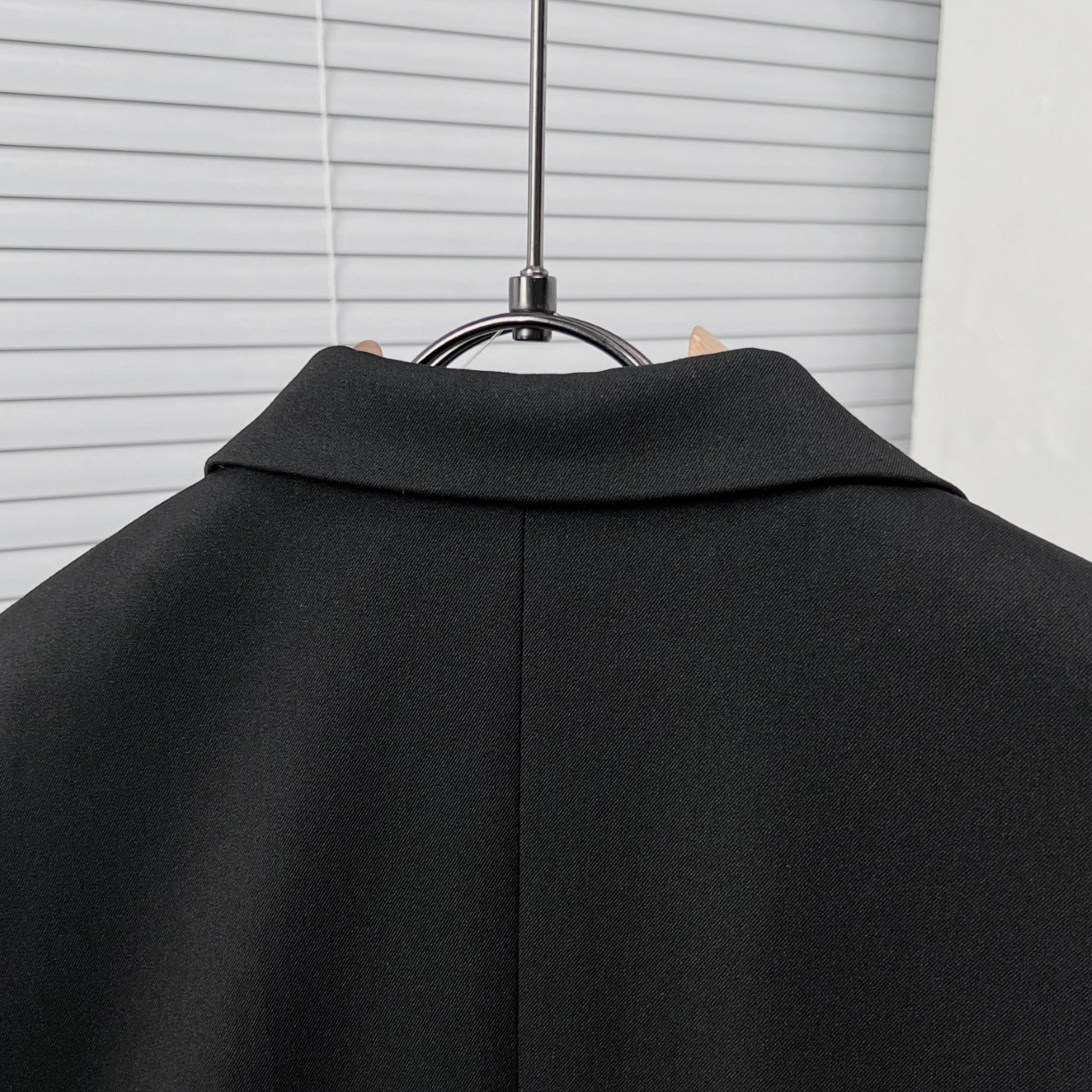 Black suit jacket neckline and back yoke with smooth collar shape