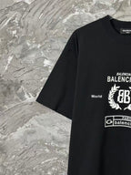 Black short-sleeve T-shirt with partial BALENCIAGA logo print at chest