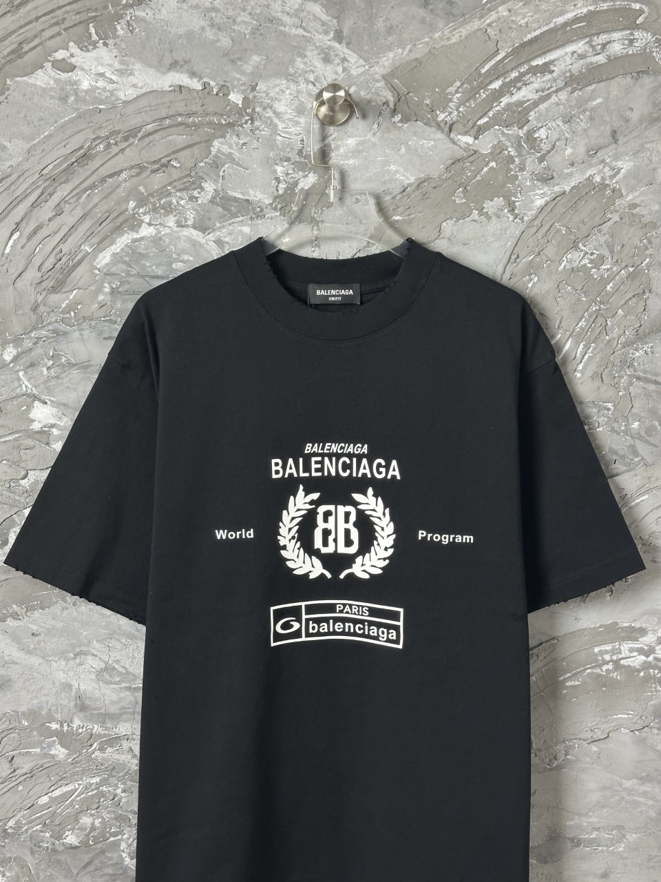 Black short-sleeve T-shirt with large BALENCIAGA emblem graphic and Paris badge