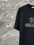 Black short-sleeve T-shirt with partial CHANEL chest logo