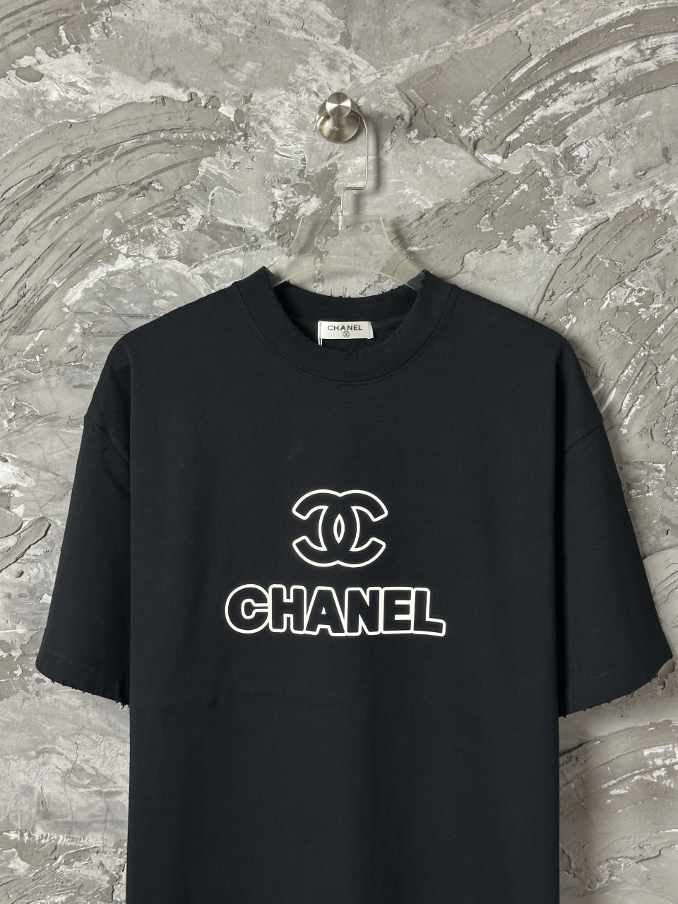 Black short-sleeve T-shirt with large CHANEL chest logo
