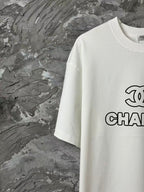 White short-sleeve T-shirt with partial CHANEL graphic on chest