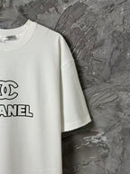 White short-sleeve T-shirt with CHANEL logo print on left chest