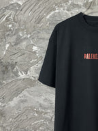 Black short-sleeve T-shirt with partial red BALENCIAGA logo at chest