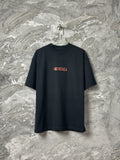 Black short-sleeve T-shirt with red BALENCIAGA logo on front