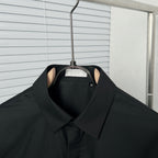 Dior long-sleeve shirt neckline, black collar with hanging brand tag