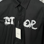 Dior long-sleeve shirt front with embroidered white letters and brand tag