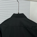 Dior long-sleeve shirt back yoke, black on a hanger