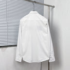 White button-up dress shirt back view with button placket and cuffs