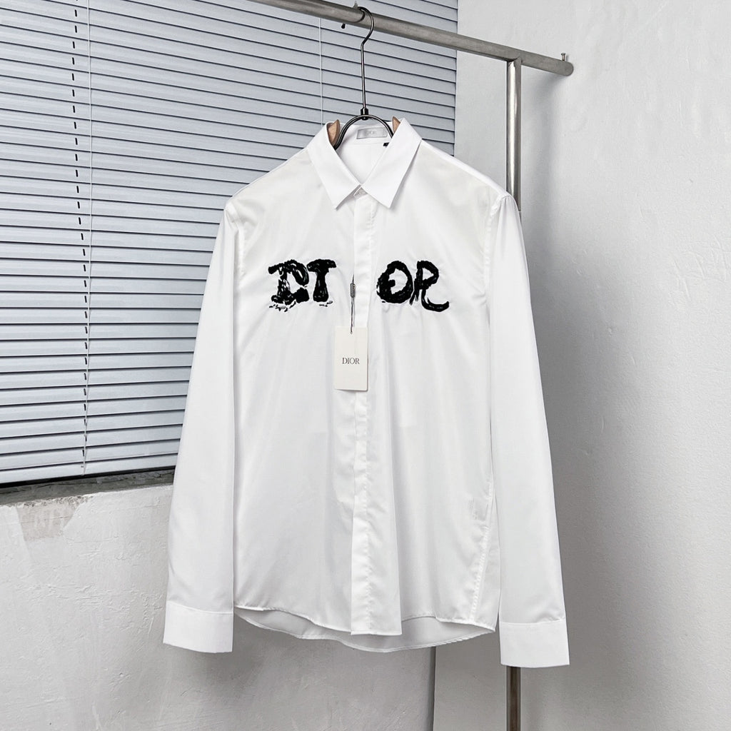 White button-up dress shirt with black graphic logo on chest