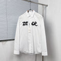 White button-up dress shirt with black graphic logo on chest