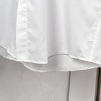 White button-up dress shirt hem and curved bottom edge