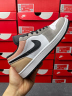 Low-top sneakers, side view in gray, white, tan suede and black swoosh
