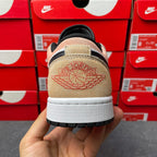 Low-top sneakers, heel view with tan suede panel and Air Wings logo