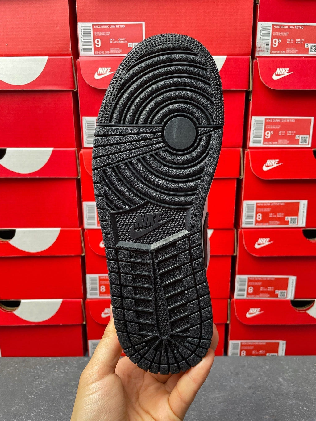Low-top sneakers, outsole view with black tread pattern and Nike mark