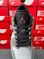 Low-top sneakers, tongue and collar view with Air Jordan logo and black laces
