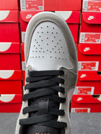 Low-top sneakers, top view of vamp with perforated toe box and black laces