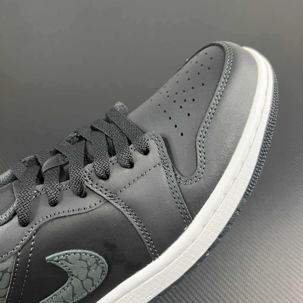 Air Jordan 1 Low toe and laces, grey suede with perforations and teal logo
