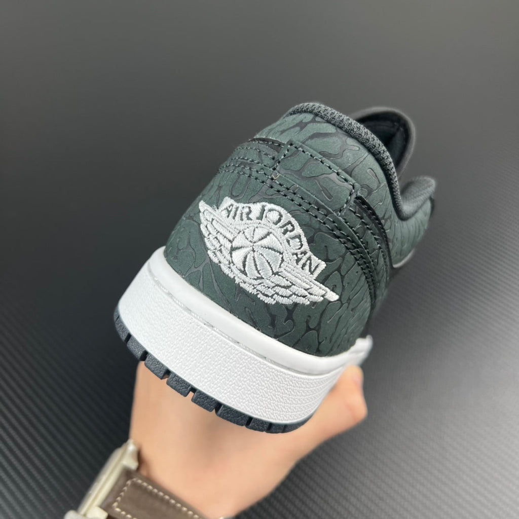 Air Jordan 1 Low heel view, teal embossed Wings logo on grey leather