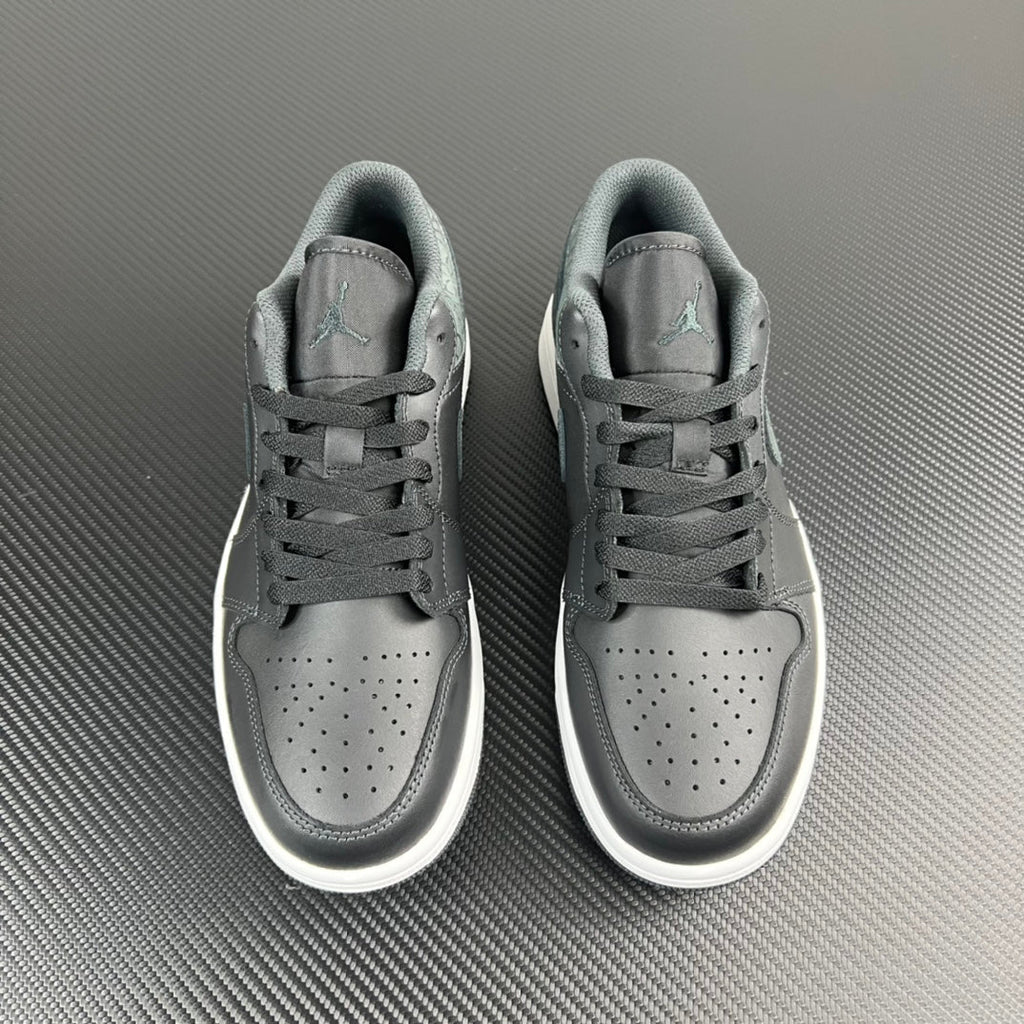 Air Jordan 1 Low sneakers pair, grey uppers with white soles, lace-up