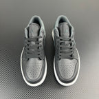 Air Jordan 1 Low sneakers pair, grey uppers with white soles, lace-up
