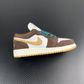 Low-top sneakers with white panels, brown suede, teal laces, yellow Nike swoosh.