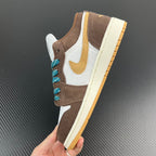 Low-top sneakers held upright, brown suede, white panels, teal laces, cream outsole.