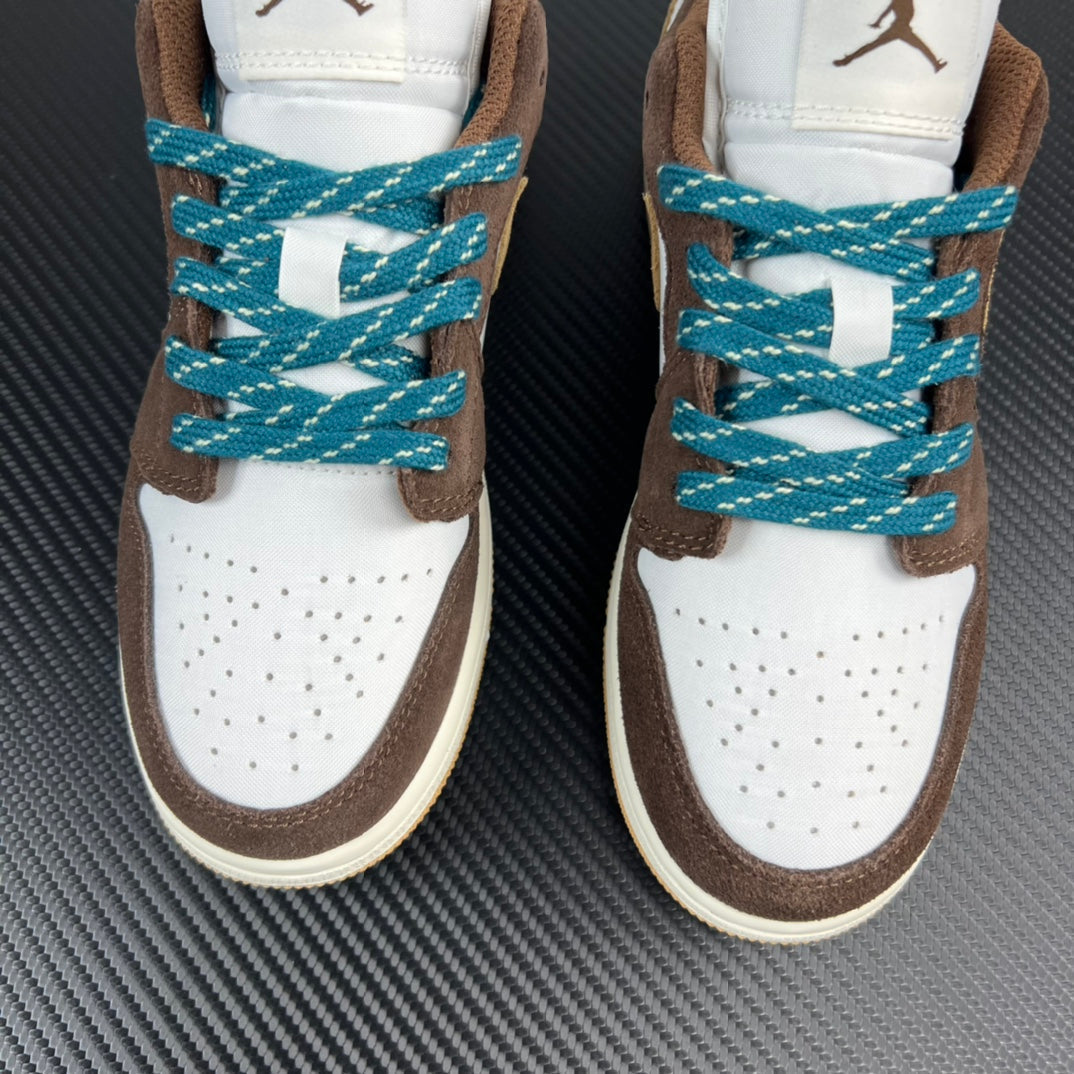 Front view low-top sneakers with white toe, brown sides, teal lace crisscross.