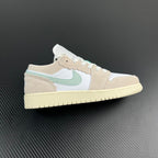 Air Jordan 1 Low sneakers with white, tan and mint swoosh, lace-up.