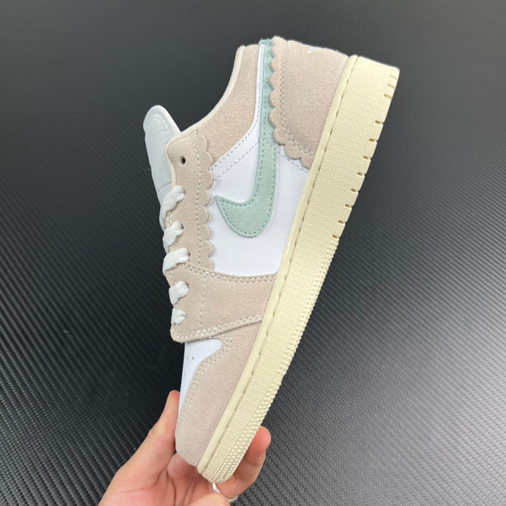 Air Jordan 1 Low heel-side view, tan overlays and mint stripe on midsole.