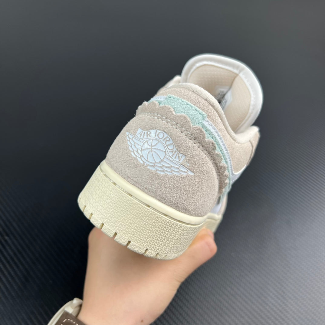 Air Jordan 1 Low heel view with Wings logo, white lining and cream sole.