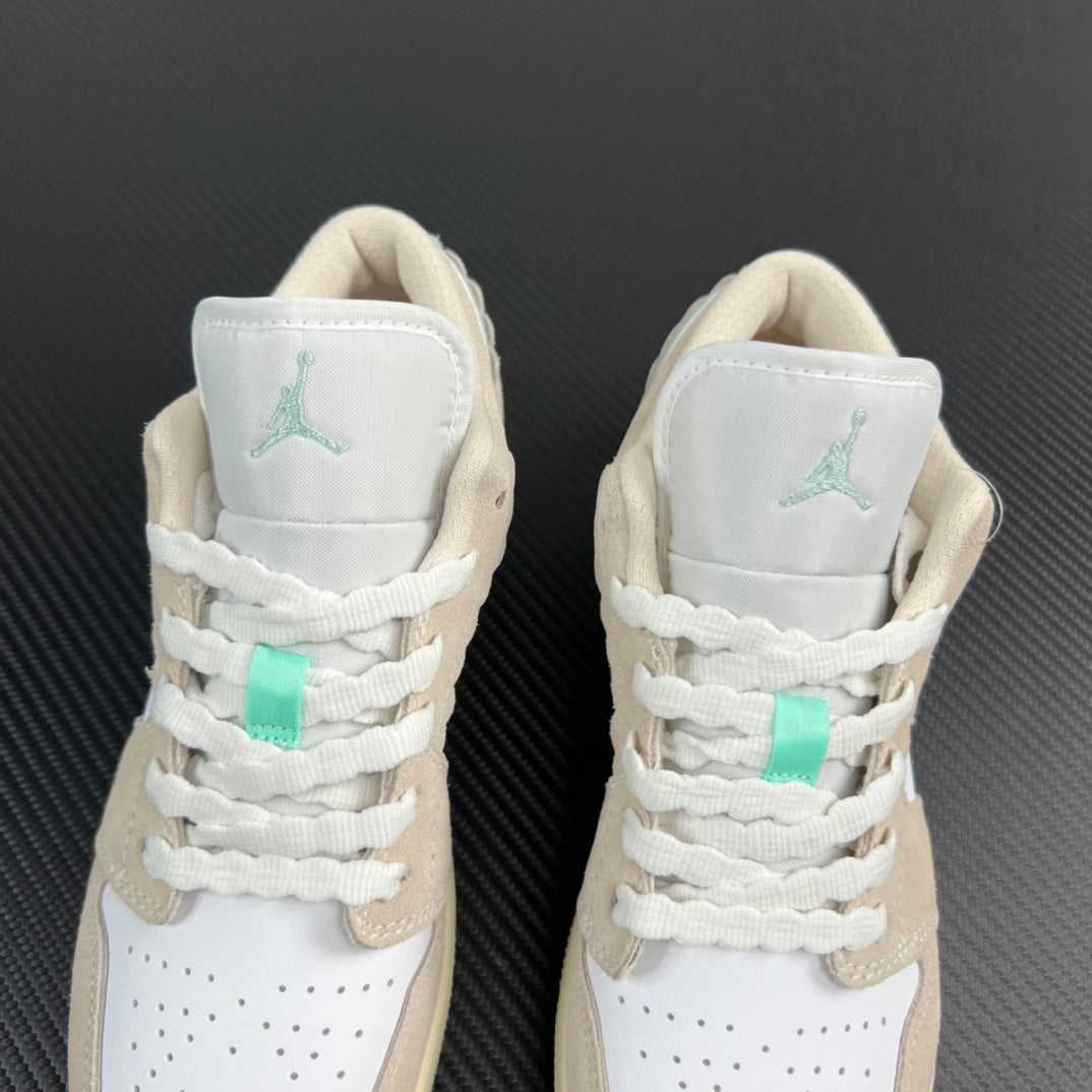 Air Jordan 1 Low pair heel view, mint Air logos on white collars and laces.