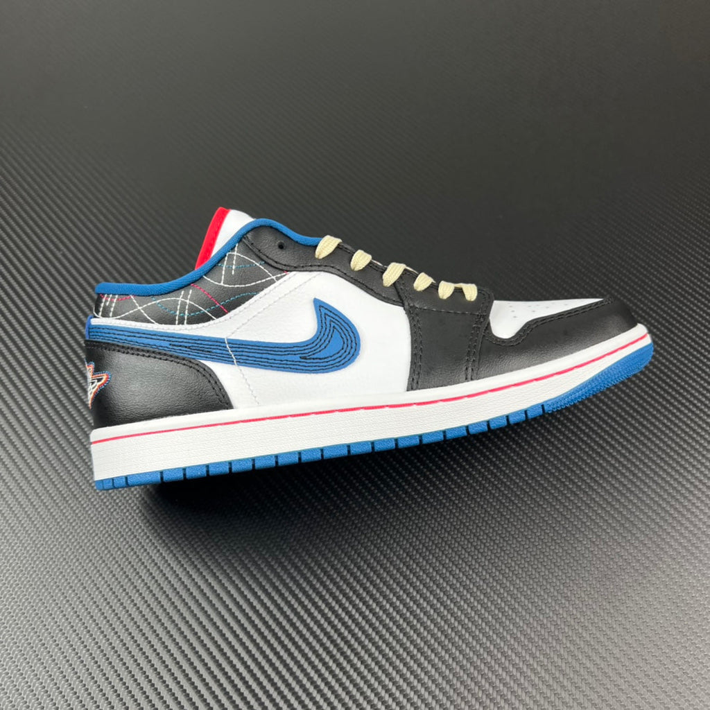 Low-top sneaker with white, black, and blue panels, cream laces, and red/blue sole