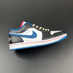 Low-top sneaker with white, black, and blue panels, cream laces, and red/blue sole
