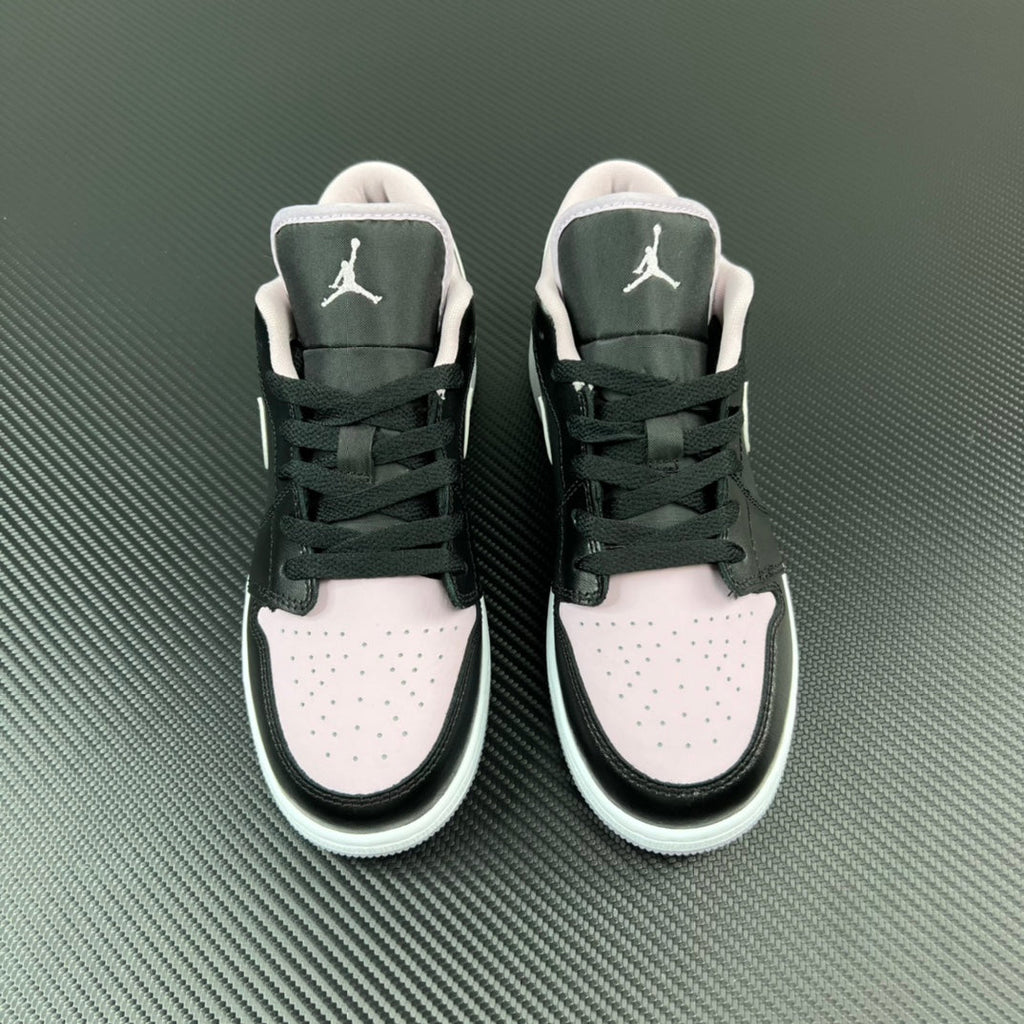 Air Jordan 1 Low sneakers pair, black uppers with white toe panels and Air logo