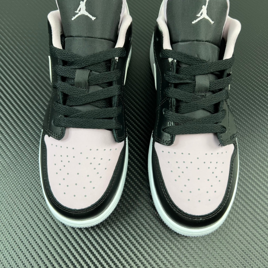 Air Jordan 1 Low sneakers pair, black and white uppers with Air logo on heels