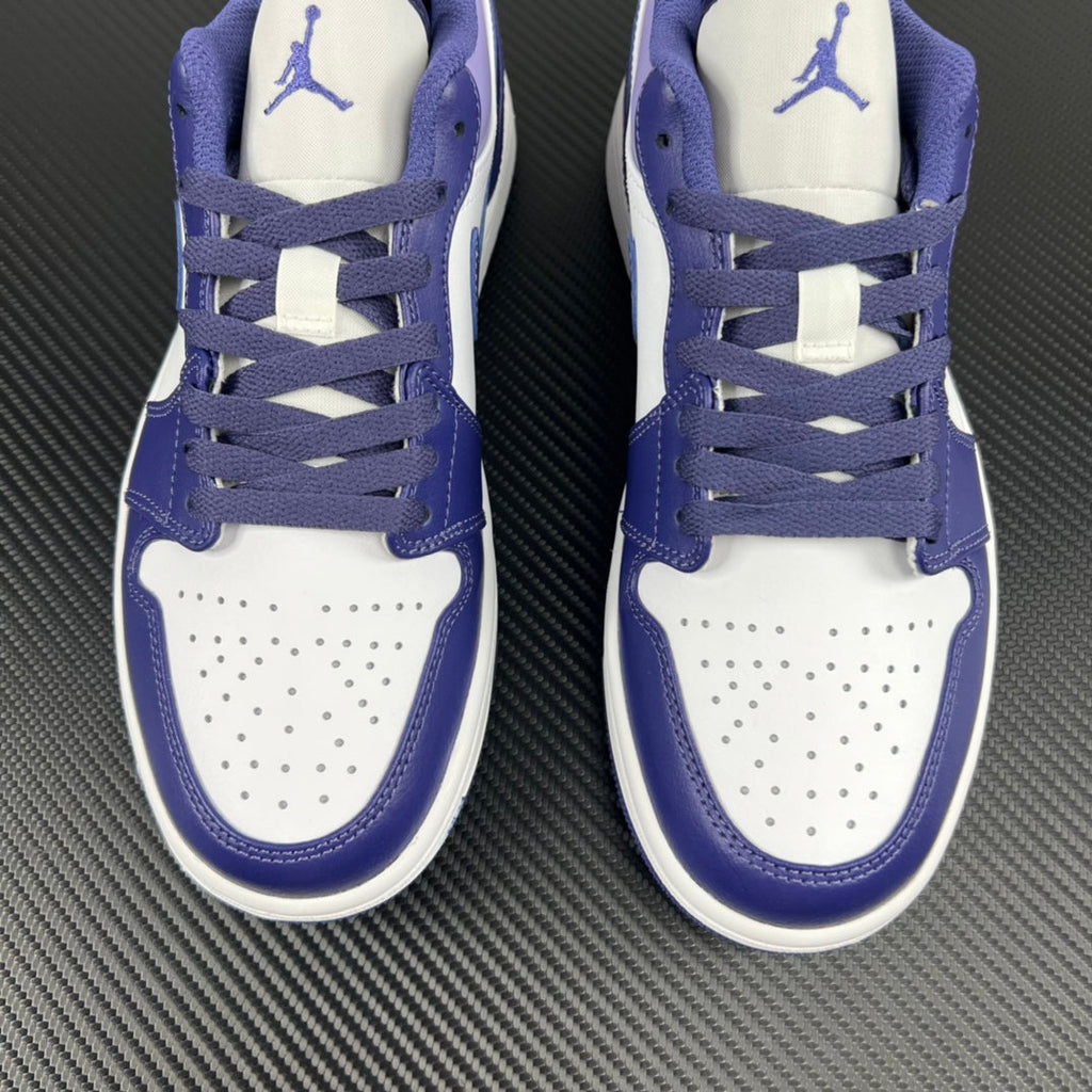 Pair of purple and white Air Jordan 1 Low sneakers, front lace pattern and perforated toe
