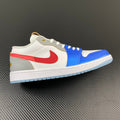 Air Jordan 1 Low sneakers with white leather, blue and red panels, lace-up design