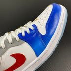 Air Jordan 1 Low sneaker upper in white with blue overlays and red swoosh detail