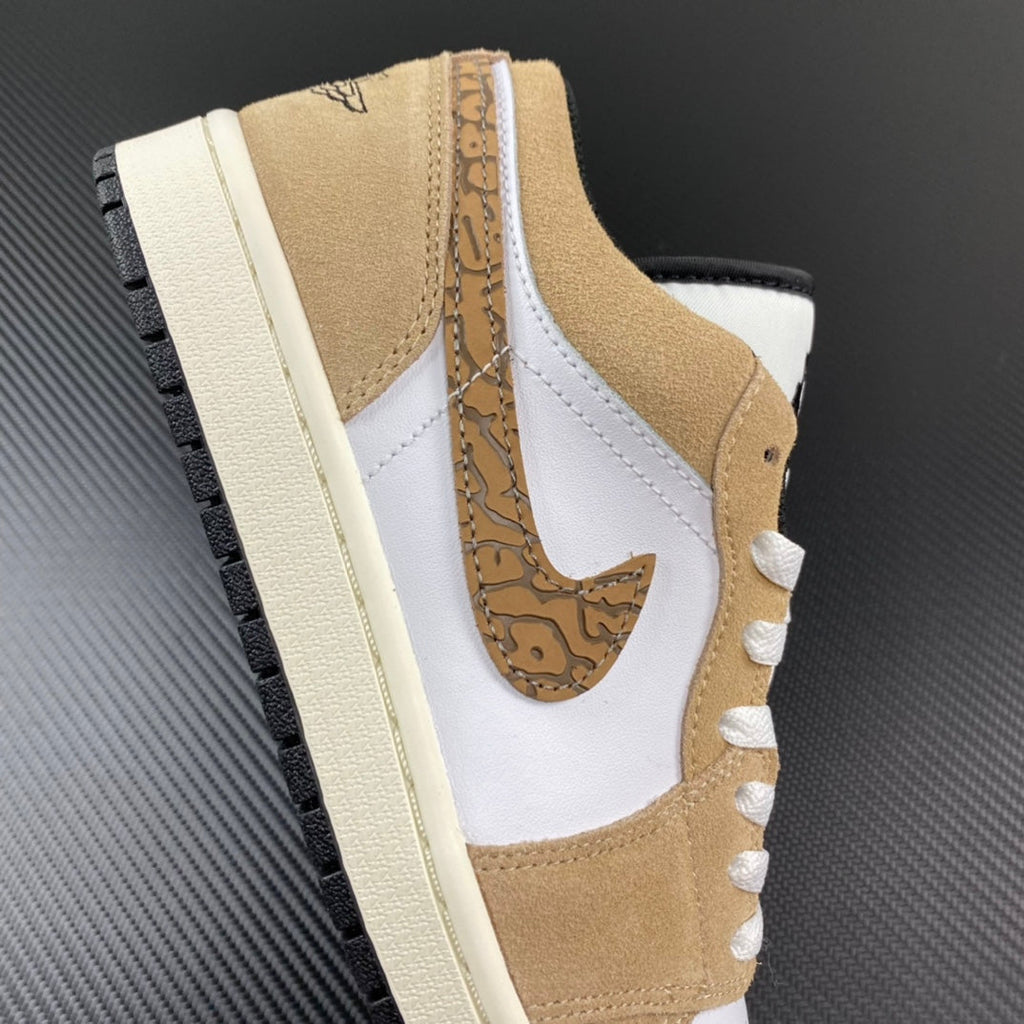 White and tan low-top sneaker with sail sole, lace-up, and detailed swoosh