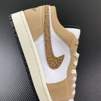 White and tan low-top sneaker with sail sole, lace-up, and detailed swoosh