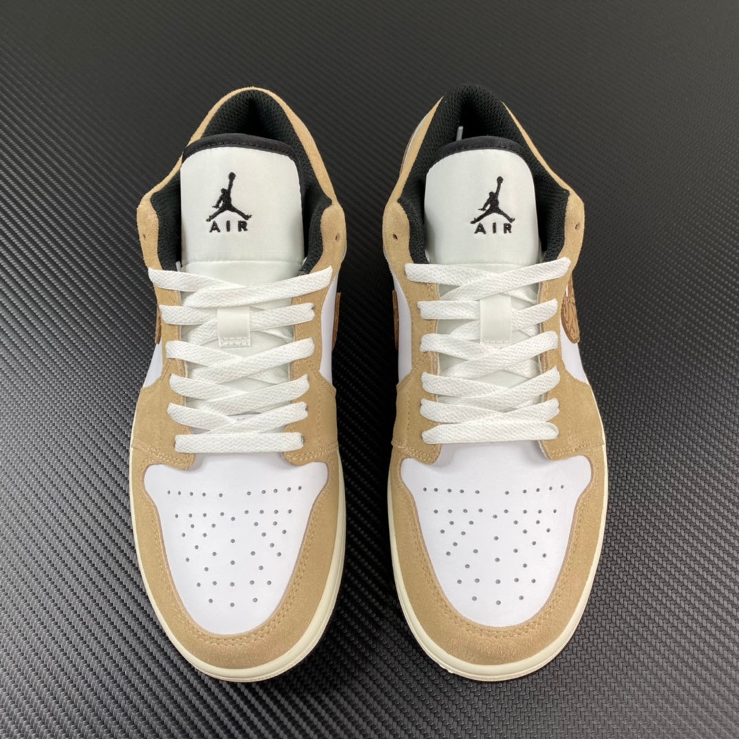 Pair of tan and white low-top sneakers with AIR branding and lace-up fronts