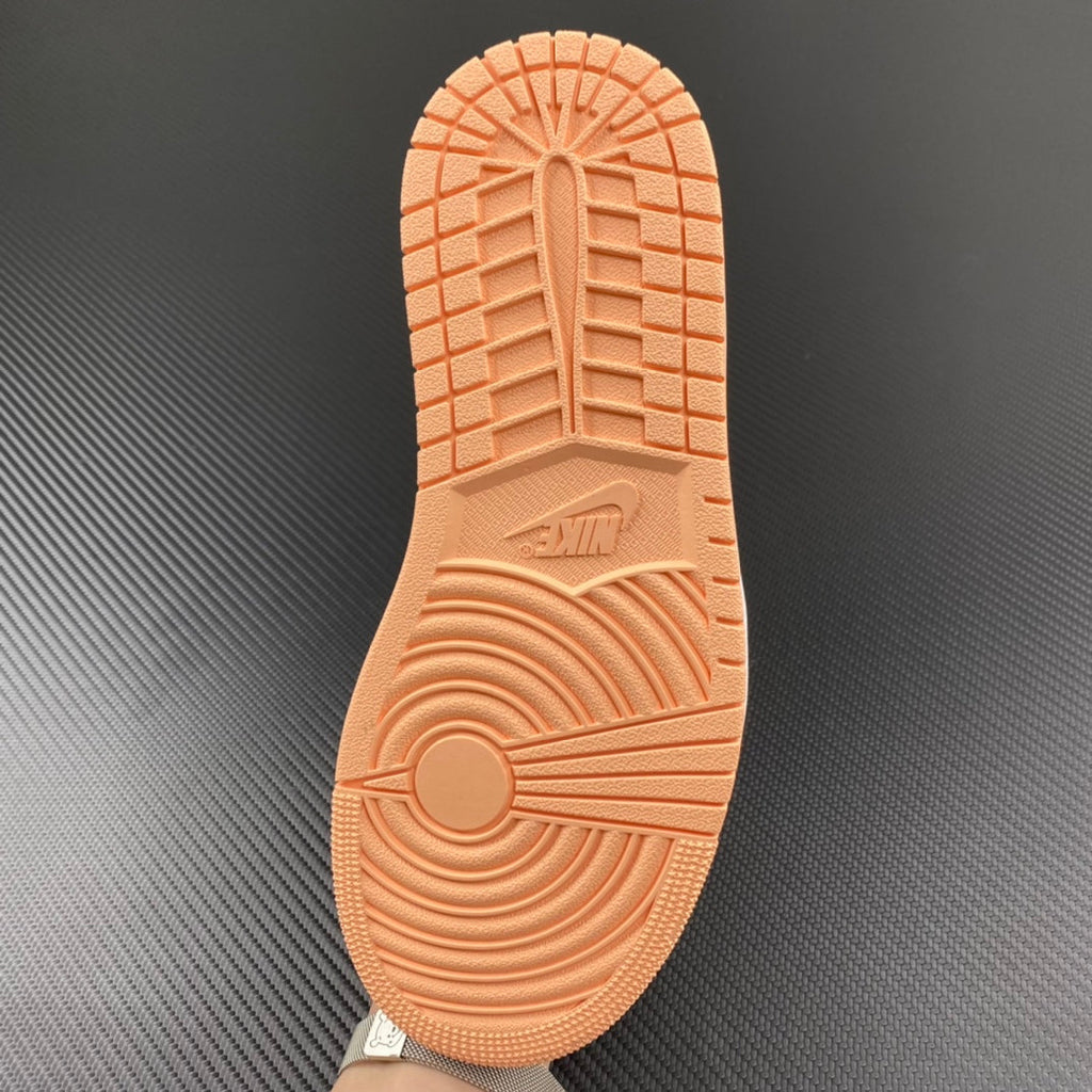 Air Jordan 1 Low rubber outsole in orange with detailed traction pattern